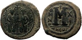 Justin II, with Sophia (565-578) AE follis (Bronze, 15.19g, 33mm) Theoupolis (Antioch) RY 10 (574/575). 
Obv: Justin and Sophia seated facing on doubl...