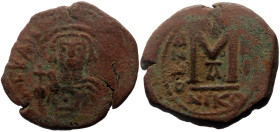 Tiberius II Constantine (578-582) AE Follis (Bronze, 10.84g, 30mm) Nicomedia, 1st officina. Dated RY 4 (?) (578/9).
Obv: Crowned facing bust, holding...