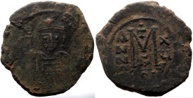 Maurice Tiberius (582-602) AE Follis (Bronze, 30mm, 11.54g).Constantinople, RY 15 (AD 596/7).
Obv: Helmeted and cuirassed facing bust, holding globus...