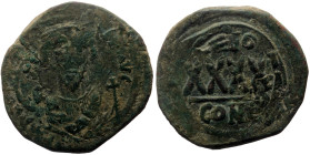 Phocas (602-610) AE Follis (Bronze, 11.52g, 31mm) Constantinople Dated year 3(?) (604/5 AD).
Obv: Crowned facing bust in consular robes, holding mapp...