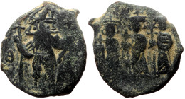Constans II, with Constantine IV, Heraclius, and Tiberius (641-668) AE Follis (Bronze, 3.70g, 19mm) Constantinople.
Obv: Constans II standing facing,...