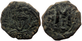 Tiberius III Apsimar (698-705) AE Follis (Bronze, 22mm, 3.43g) Constantinople
Obv: Facing bust with short beard, wearing crown and cuirass, holding tr...