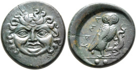SICILY. Kamarina. Circa 420-405 BC. Tetras or Trionkion (Bronze, 17 mm, 4.16 g, 4 h). Facing gorgoneion. Rev. ΚΑΜΑ Owl standing right, head facing, ho...