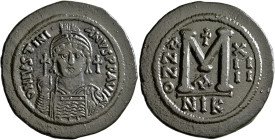 Justinian I, 527-565. Follis (Bronze, 42 mm, 22.00 g, 6 h), Nicomedia, RY 14 = 540/1. D N IVSTINIANVS P P AVI Helmeted and cuirassed bust of Justinian...
