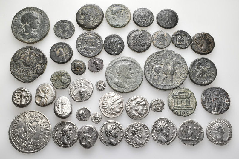 A lot containing 40 silver and bronze coins. Including: Greek, Roman Provincial,...