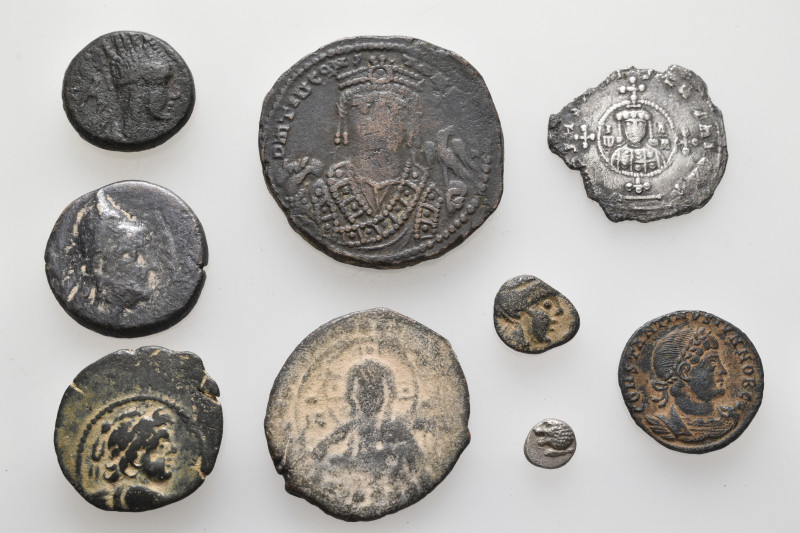 A lot containing 9 silver and bronze coins. Including: Greek, Oriental Greek, Ro...