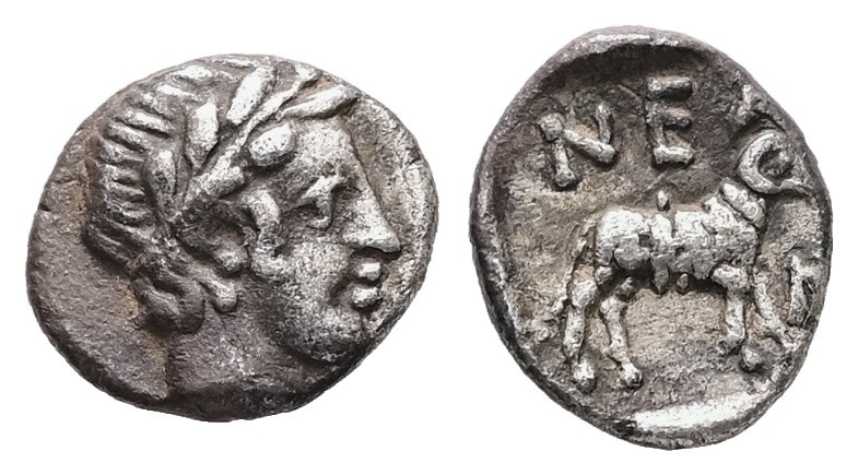 Troas, Neandria. AR Hemiobol, 0.54 g 7.95 mm. 4th century BC.
Obv: Laureate head...