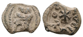 PB Roman tessera (c. AD 4th–5th centuries)
Obv: Two standing figures, facing one another, clasping hands. Border of dots.
Rev: Christogram. Illegible ...