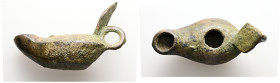 Roman bronze lamp (c. AD 1st century)
Bronze lamp; circular body and angular sides; loop handle terminating in a vine leaf.
Diameter: 70.22 mm.