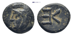 Troas. Kebren circa 400-300 BC. AE. (8mm, 0.7 g) Youthful head of satrap left wearing Persian headdress and wreathed with laurel Rev. Large K E monogr...