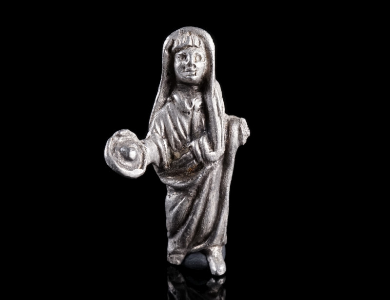 A SMALL ROMAN SILVER STATUETTE OF A GENIUS
Circa 1st-early 2nd century AD.
Fin...