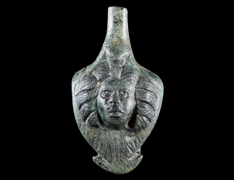 A ROMAN BRONZE JUG HANDLE WITH A FEMALE HEAD
Circa 2nd-3rd century AD.
Lower p...