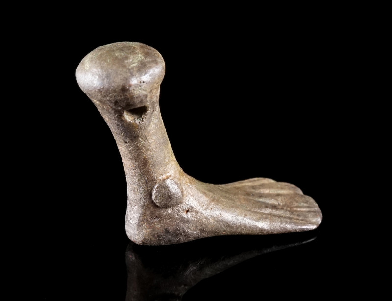AN ANCIENT BRONZE AMULET PENDANT IN THE SHAPE OF A FOOT
Circa 4th-1st century B...