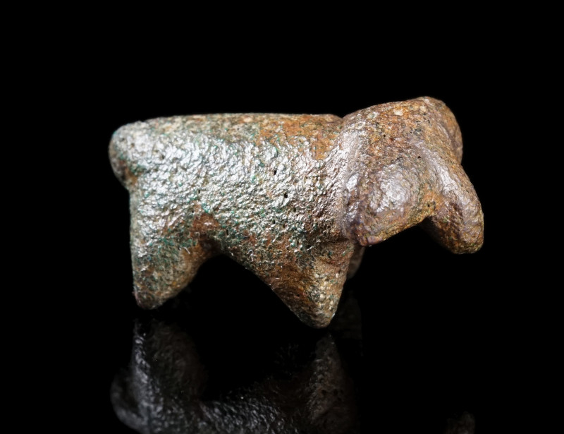 A SMALL ARCHAIC VOTIVE FIGURE OF A RAM
Circa 8th-7th century BC.
Small stylise...
