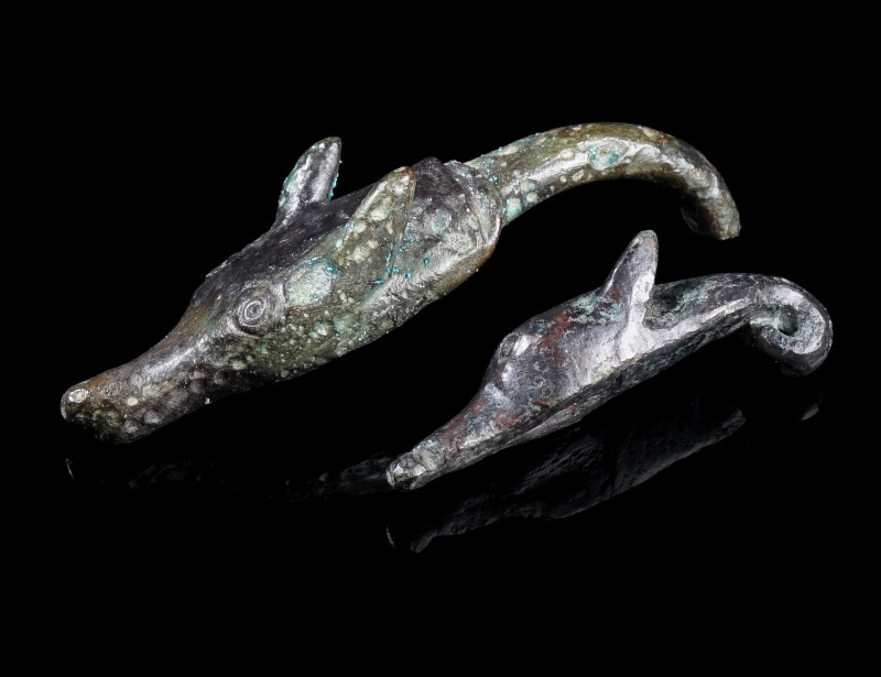 TWO ROMAN BRONZE TERMINALS WITH WOLF HEAD
Circa 1st-2nd century AD.
Most proba...