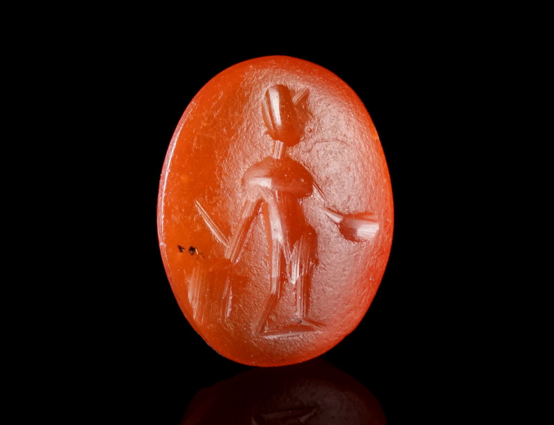A ROMAN CARNELIAN INTAGLIO WITH A STANDING FIGURE
Circa 2nd-3rd century AD.
Th...