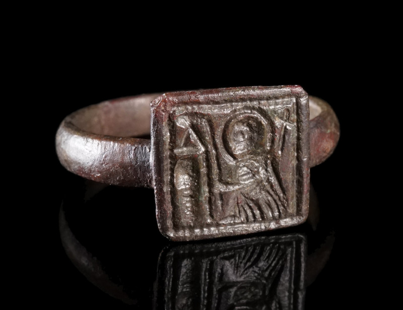 A BYZANTINE BRONZE RING WITH A SAINT
Circa 5th-7th century AD.
Ring with squar...