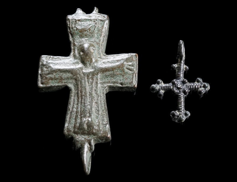 TWO BYZANTINE BRONZE CROSSES
Circa 6th-12th century AD.
One half of a reliquar...