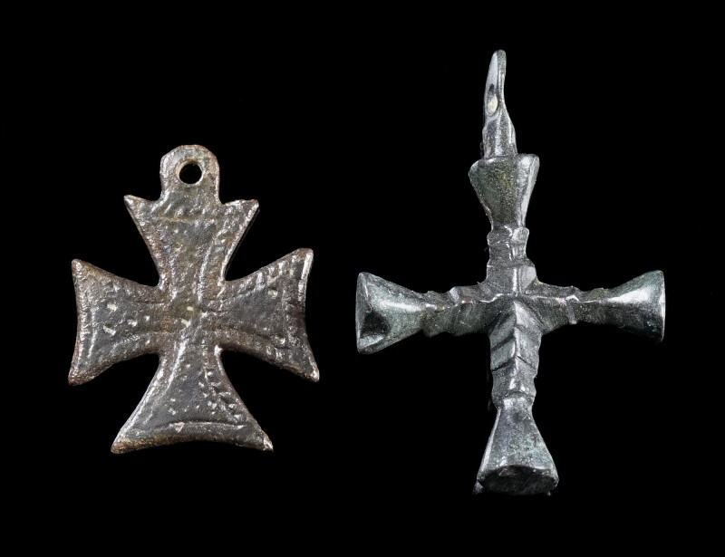TWO BYZANTINE BRONZE CROSS PENDANTS
Circa 6th-12th century AD.
Two cross penda...