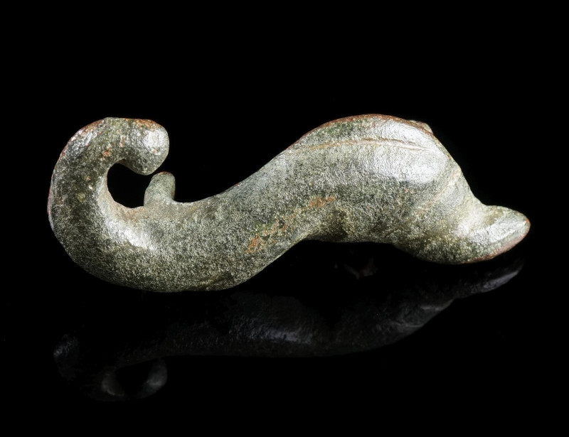 A ROMAN BRONZE DOLPHIN BROOCH
Circa 2nd-3rd century AD.
Modelled in the shape ...