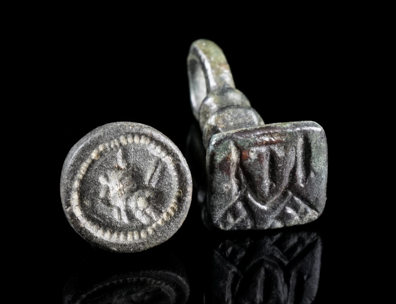 TWO BYZANTINE BRONZE STAMP SEALS
Circa 10th-12th century AD.
Two seal matrices...