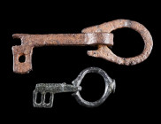 TWO BYZANTINE / EARLY MEDIEVAL FOLDING KEYS
Circa 5th-6th century, and probably 8th-11th century AD.
A Byzantine bronze folding key, and an early Me...