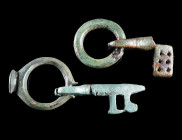 TWO BYZANTINE BRONZE FOLDING KEYS
Circa 5th-6th century AD.
Both with an offset bit and attached to a ring. The ring of the smaller example does pro...