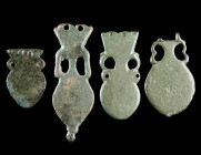 A GROUP OF FOUR ROMAN BRONZE AMPHORA-SHAPED STRAP-ENDS
Circa 4th century AD.
Four late Roman strap-ends from military belts.
L 29-58 mm

Ex Europ...