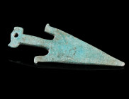 AN ANCIENT BRONZE ARROW/ANCHOR SHAPED FITTING
Probably Roman, circa 2nd-3rd century AD (?).
Fitting with a rivet hole and a rectangular strap loop o...
