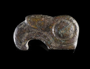 A SCYTHIAN BRONZE EAGLE HEAD FITTING
Circa 7th-6th century BC.
Heavy, solid cast plaque in the form of a stylised eagle head; with a strap loop on t...