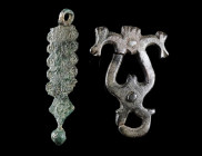 TWO ROMAN BRONZE OPENWORK BELT FITTINGS
Circa 1st century, and 3rd century AD.
A decorated pendant from an Early Roman military horse harness, and a...