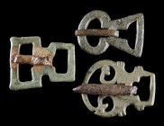 A GROUP OF THREE ROMAN BRONZE MILITARY BELT BUCKLES
Circa 2nd-3rd century AD.
Various forms, all with a loop for attachment at the back. Two of the ...