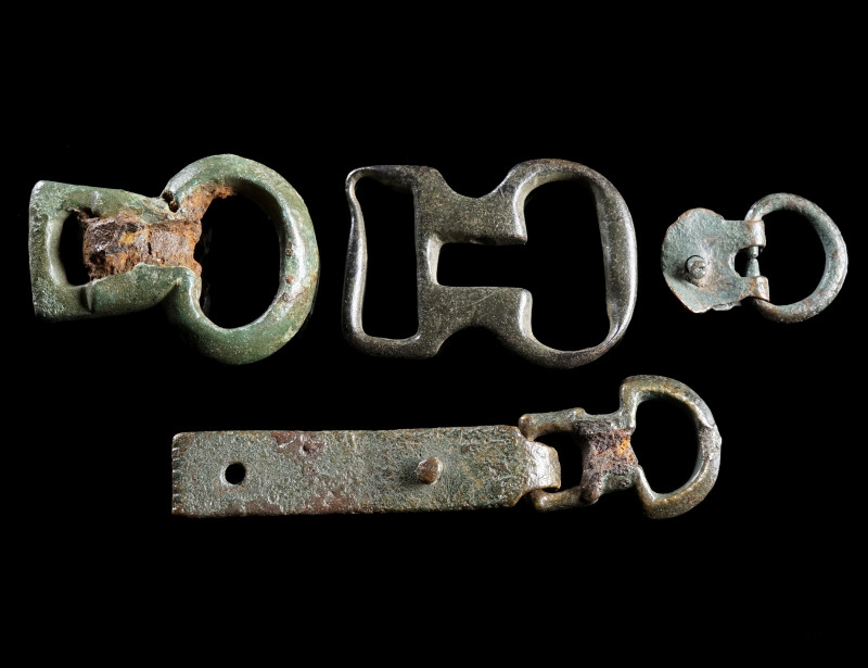 A GROUP OF FOUR ROMAN BRONZE MILITARY BUCKLES
Circa 1st-3rd century AD.
Variou...