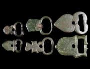 A GROUP OF SIX LATE ANTIQUE / BYZANTINE BRONZE BELT BUCKLES
Circa 4th-7th century AD.
Various forms and types. Studs or lugs for fixing to the belt ...