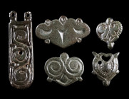 A GROUP OF FIVE AVAR / BYZANTINE PERIOD BRONZE BELT FITTINGS
Circa 8th-11th century AD.
Four decorated Byzantine-style belt appliques with two to th...