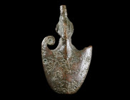 A ROMAN BRONZE SCABBARD CHAPE FROM A DAGGER/KNIFE
Circa 2nd-3rd century AD.
Pelta-shaped chape with a stylised dolphin; decorated with ring-and-dot ...