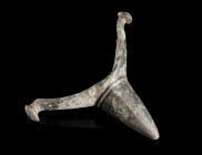 A GERMANIC BRONZE SPUR 
Circa 2nd-3rd century AD. 
Prick spur with central goad and side arms with discoid lugs. Some earthen deposits.
L 50 mm, W ...