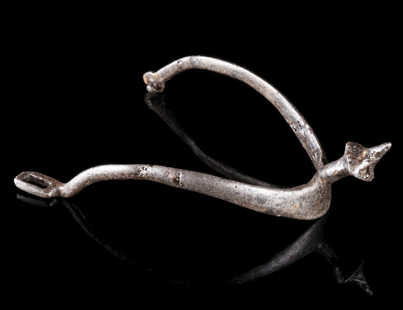 A MEDIEVAL IRON PRICK SPUR
Circa 12th-13th century AD.
Spur with heavily curve...