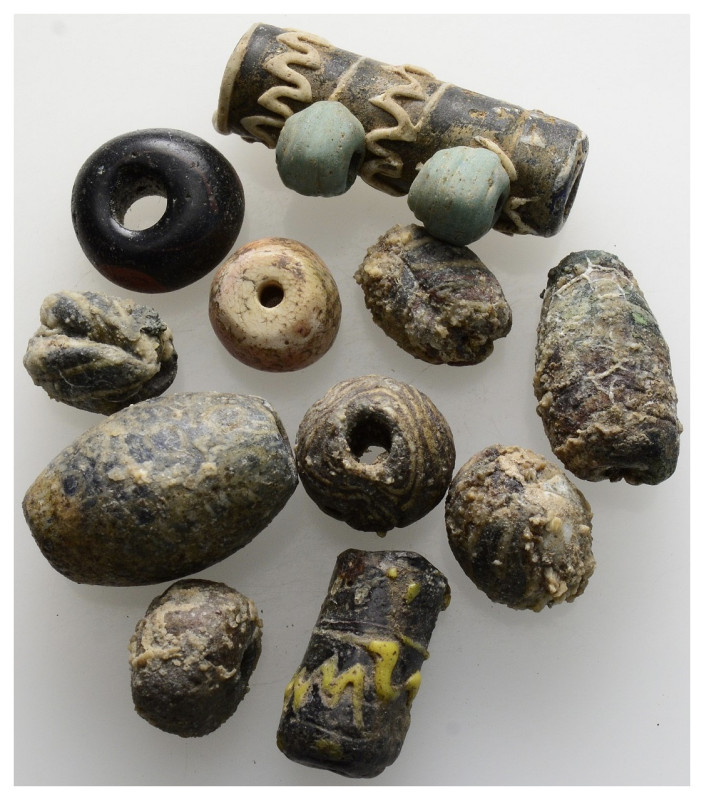 ANCIENT GLASS BEAD GROUP (Lot of 11). Circa 1st-4th century AD or earlier. Good ...