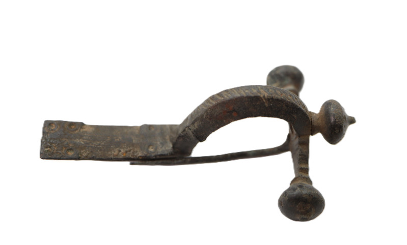 A solid bronze crossbow brooch, deep bow, trapezoidal footplate with chamfered e...