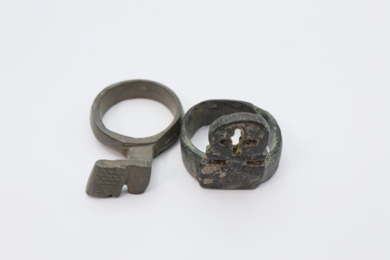 Two bronze key-rings, dark green patina intact; length 20 mm to 30 mm, 15.06 gra...