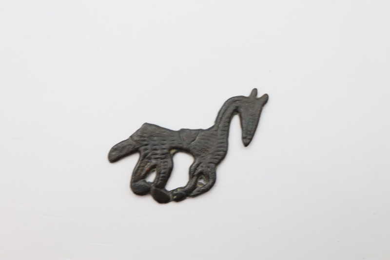 A bronze pendant - amulet in the shape of a horse; brown patina is intact; 2.31 ...