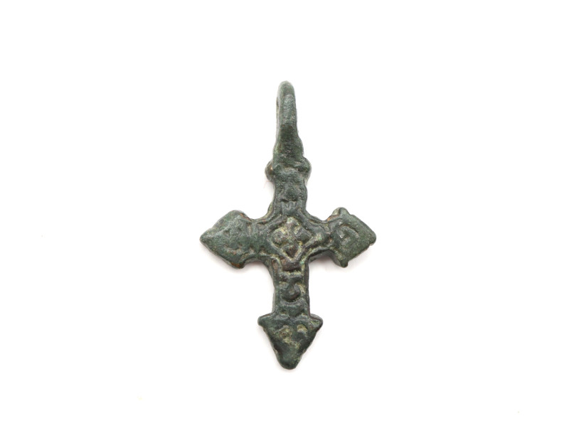 A solid bronze cross pendant with olive-green patina and loop intact, overall de...