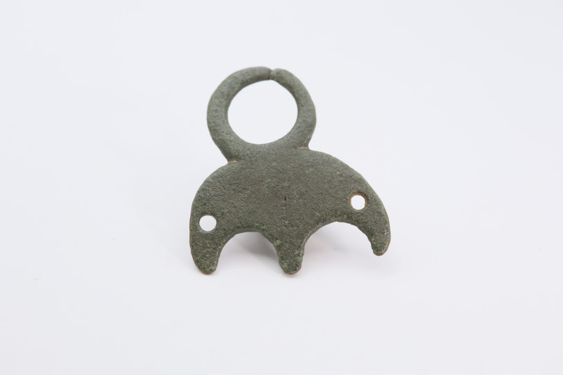 A bronze Viking pendant with large suspension loop, green patina intact; 25 mm, ...