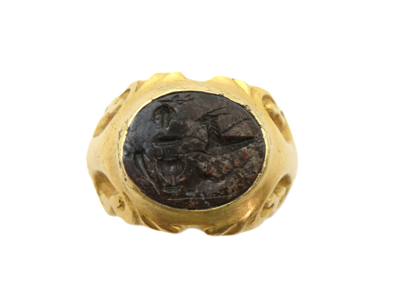 Substantial - solid gold ring with enlarged shoulders supporting bezel with enca...