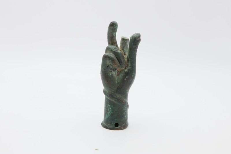  Cast bronze hand with socketed end and hole for an attachment pin. Snake around...