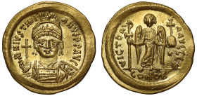 Justinian (527 –565), gold Solidus, Constantinople, officina Θ, D N IVSTINIANVS P P AVC, helmeted bust facing, holding globus cruciger and shield deco...
