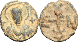 PB Bulla, 6th-7th century. Obv. Bust of a saint facing, nimbate. Rev. Monogram. PB. 6.52 g. 18 mm. VF.