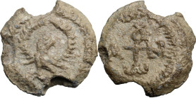 PB Seal, 8th-12th century. Obv. Cruciform invocative monogram. Rev. Eagle with wing spread within wreath. Lead. 8.77 g. 22 mm. VF.