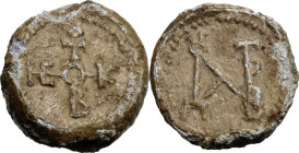 PB Seal, 8th-12th century. Obv. Cruciform invocative monogram. Rev. Monogram. Lead. 24.45 g. 24 mm. Good VF.